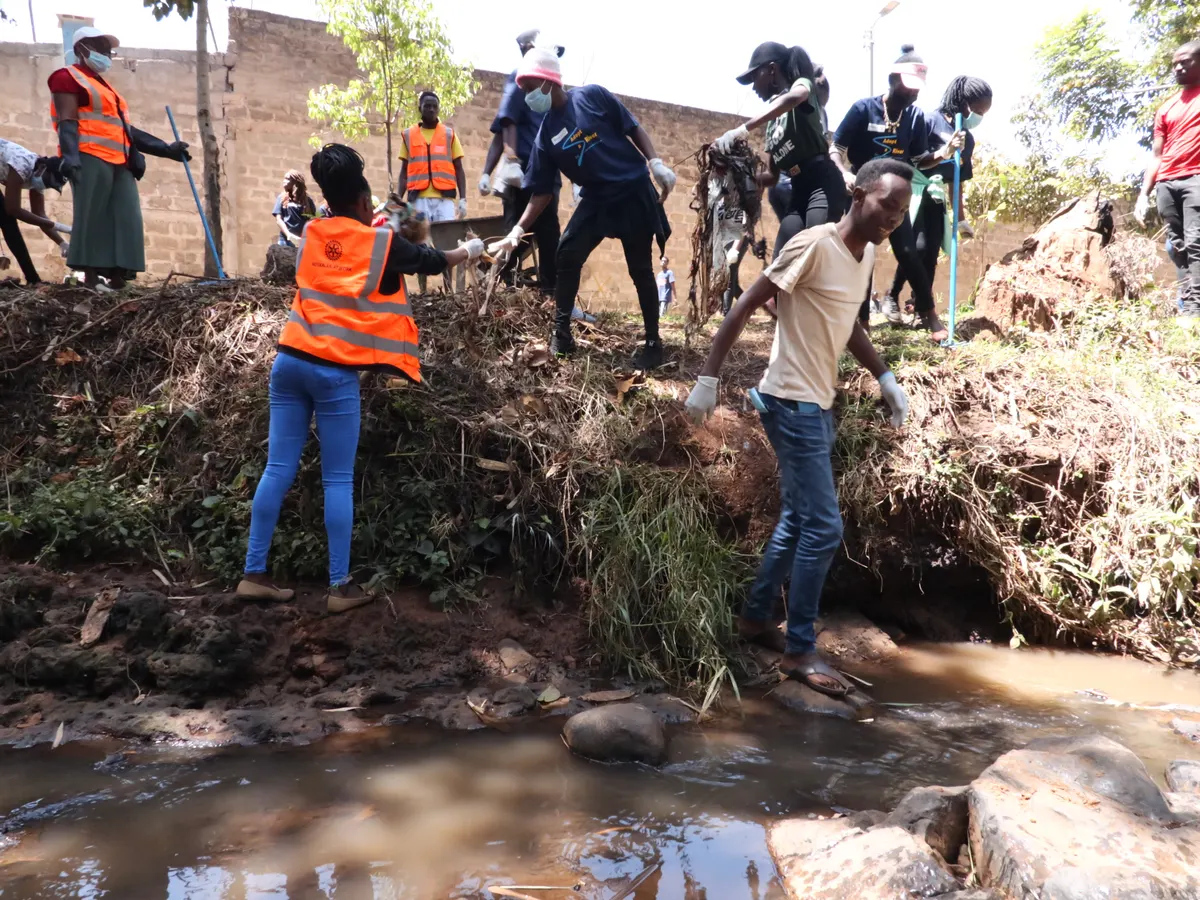 Rotarians and volunteers clearing vegetation along the banks of River Sosiani